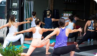 Group of people practice yoga